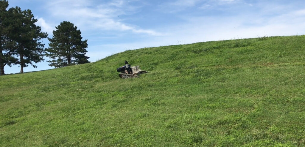 AGV Robot moving along a grassy slope