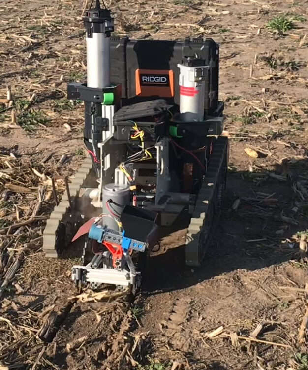 Drill robots planting grain seed in a field 